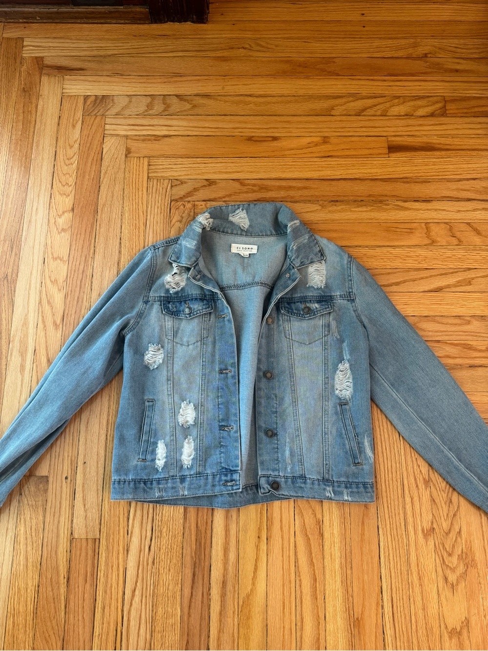 Women’s Distressed Light Blue Denim Jacket